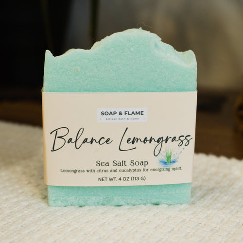 Bar of sea salt soap with 'Balance Lemongrass' label on a textured surface