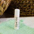Lip balm tube labeled Refresh Mint