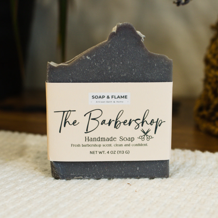 Handmade soap bar with a label on a textured surface