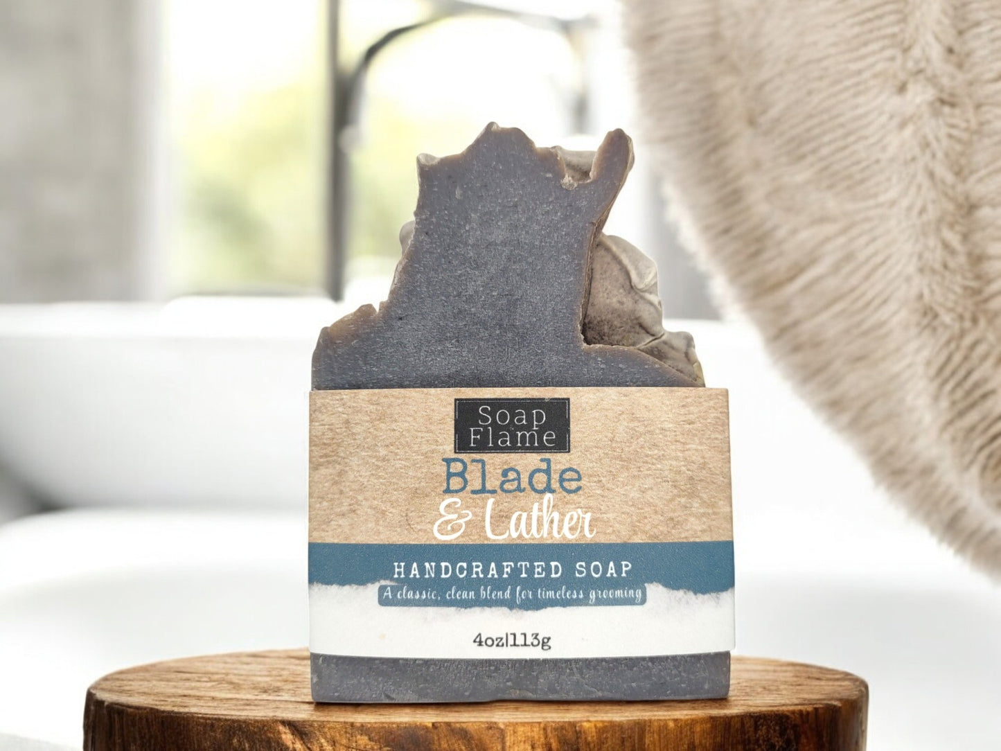 blade and lather black barbershop bath soap with label in a bathroom 