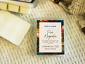 Pink Magnolia wax melt packaging on a textured surface
